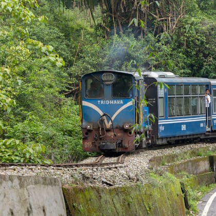 The Darjeeling Himalayan Railway toy train winding through the hills